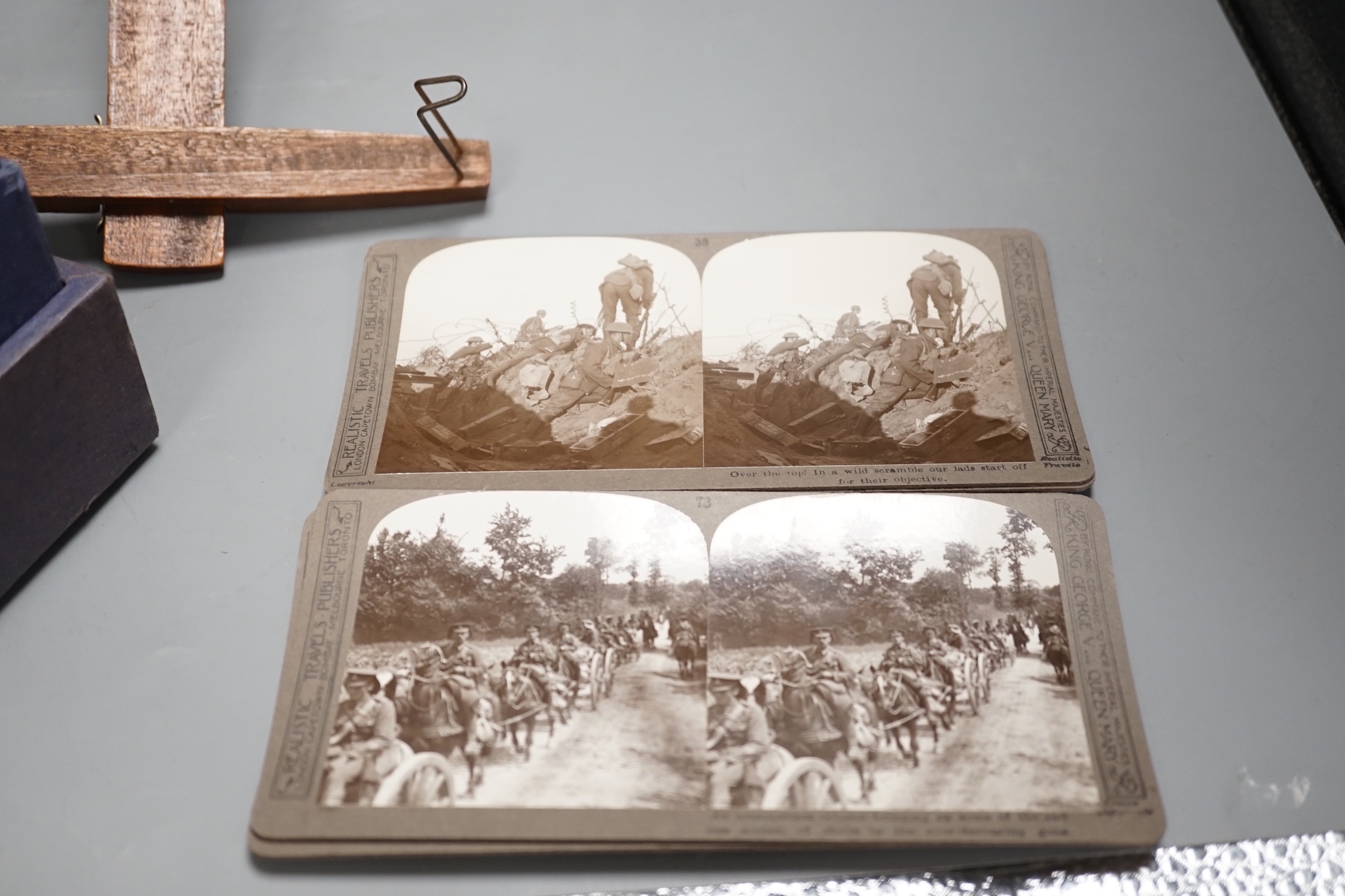 An early 20th century Underwood & Underwood stereoscopic viewer and a set of Great War monochrome cards in faux book binding.